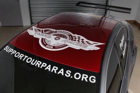 Infiniti Support Our Paras Racing Car, view of logo on roof, 2015.