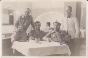 The three must have beers: two members of the 8th Battalion with an RAF NCO, Cairo 1946