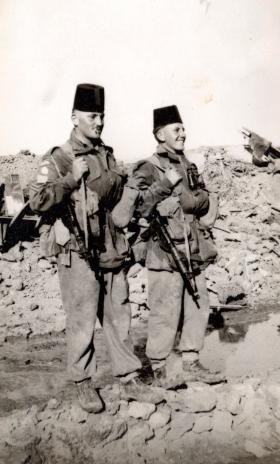 Two members of 3 PARA after the demolition of the village of Gaynaeim, Canal Zone, 1952.
