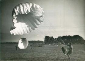 Recruit collapses his parachute after landing at Tatton Park.