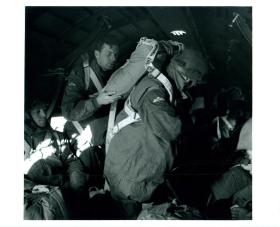 Paratroopers getting ready for training jumps out of a Douglas Dakota aircraft.