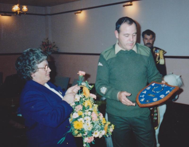 Sid Dewey's wife receiving  shield