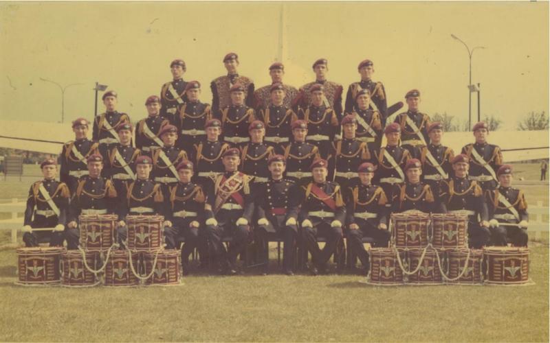 Colour image of the 1st battalion Band with their drums stacked.