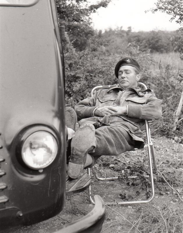 Richard Todd sleeping in a deck chair on the set of "The Longest Day", Normandy, 1959.