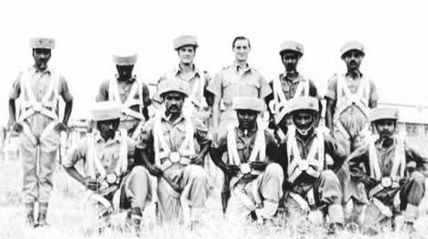 OS John B Sanderson with recruits wearing 'sorbo' helmets, India