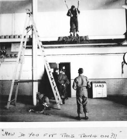 OS Major John Sanderson attaches indoor  parachute harness. Rawalpindi 1944