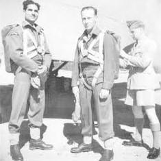 OS Jock Grimmond having parachute fitted. Mohn Kahn watching. Rawalpindi 1944