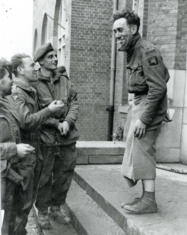 OS Capt HF Bear Nijmegen. 26-27 Sep 1944 with blanket wrapped around legs, wearing civilian shoes