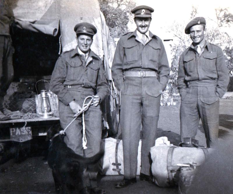 OS John Sanderson with the regimental Mascot Dog Susan and colleagues 1945