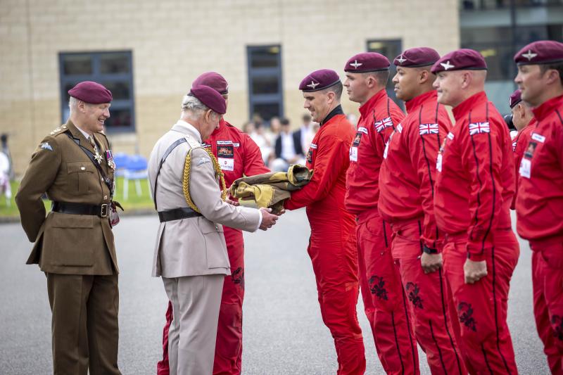 OS Red Devils presenting HRH with a 'Banana' pattern smock 