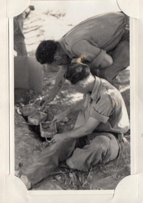 joe lee and comrade cooking in a mess tin over an open fire