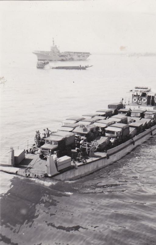 OS 1951-06-15 Vehicles go ashore from HMS Triumph, Famagusta, Cyprus (HMS Warrior in background) 
