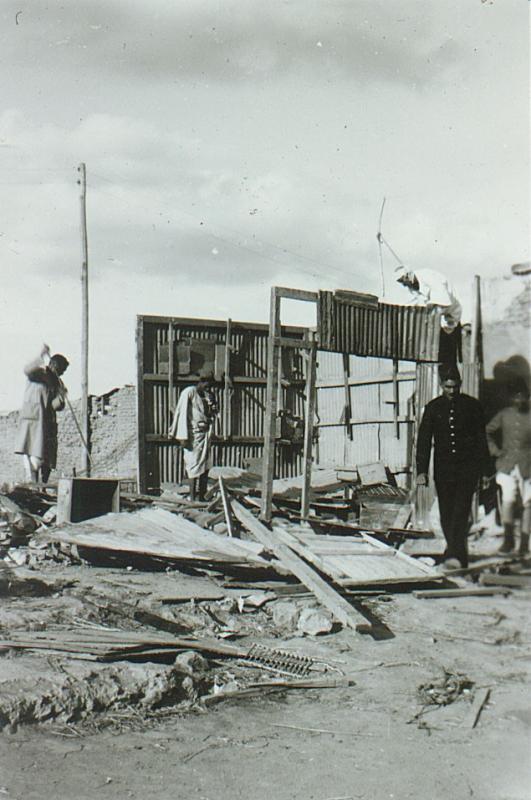 OS 1951-11-10 Egyptians wrecking their house before leaving Canal Zone (DH pic).jpg