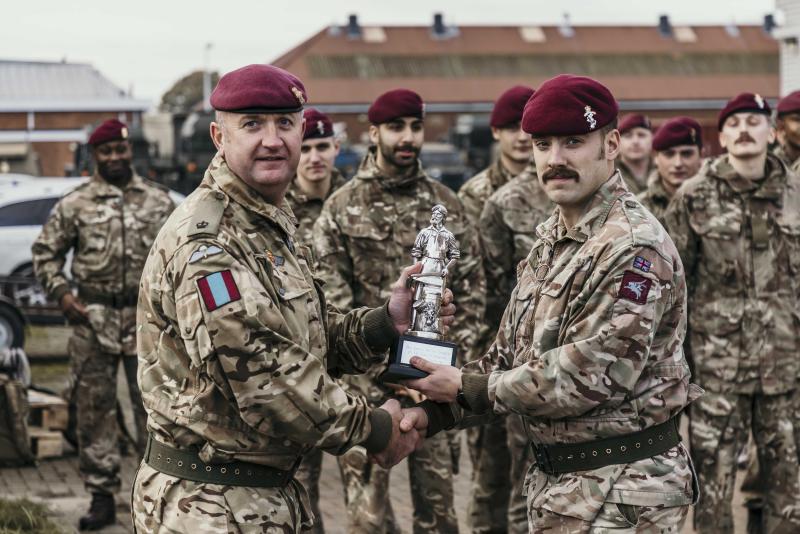 OS Maj Aidy Mortimore presenting the winners trophy to Cpl A Birch of 8 Fld Coy para REME