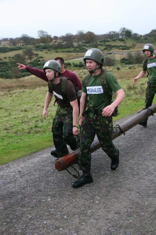 OS M Flynn participating in a log race