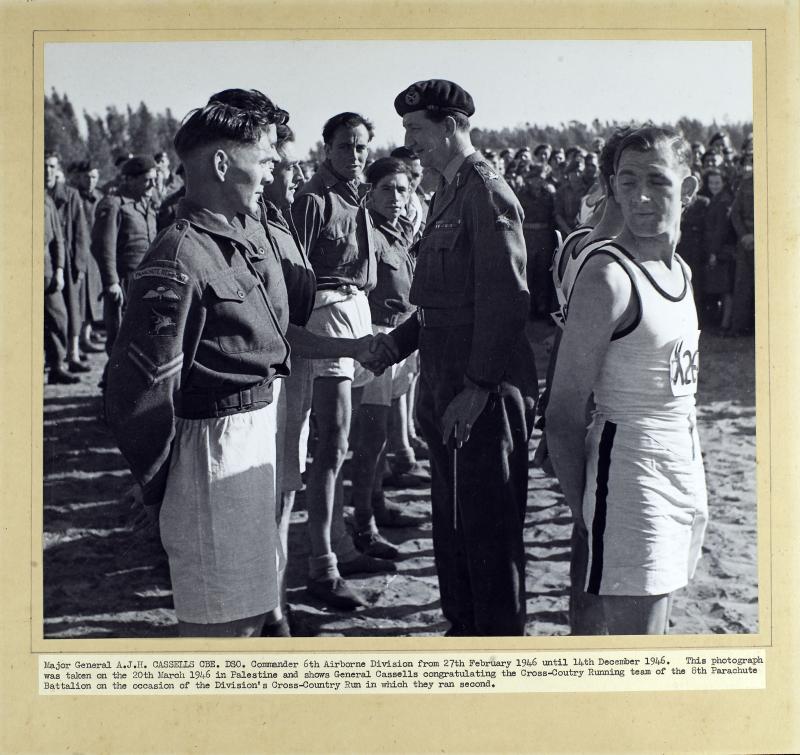 Major General A.J.H Cassels congratulates the Cross-Country Running team of the 8th Parachute Battalion, 1946