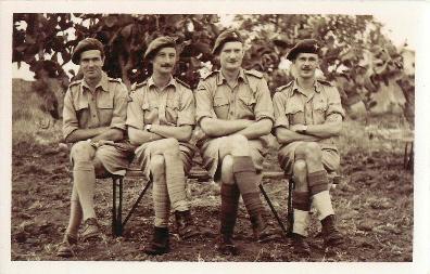 Four officers including Major John Pearson seated with arms crossed.
