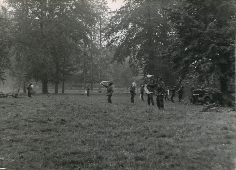 British troops wave resupply planes to get their attention in the grounds of teh Hartenstein Hotel.