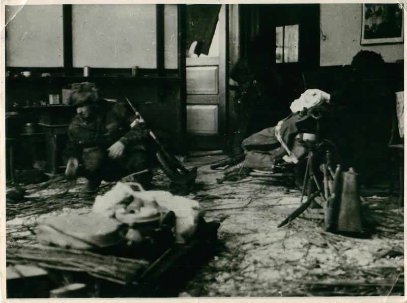 Polish paratroopers in a heavily shell ravaged building  in Driel where they dropped.