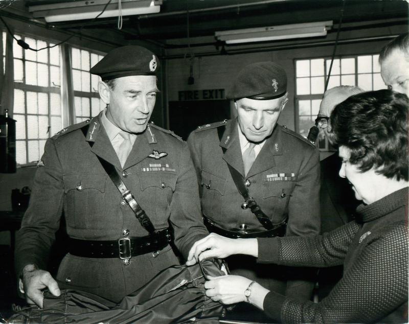 Major General Frank King MBE and Lieutenant Colonel Adams MBE inspecting an extractor parachute.