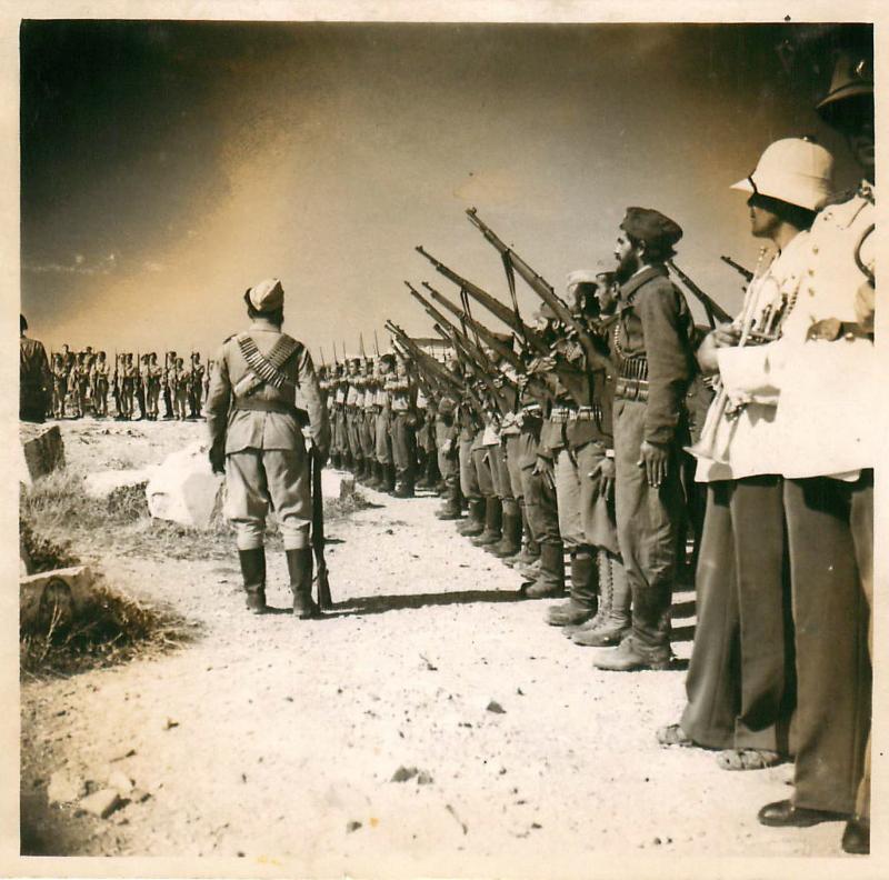 Troops from the Greek People's Liberation Army line up for inspection.
