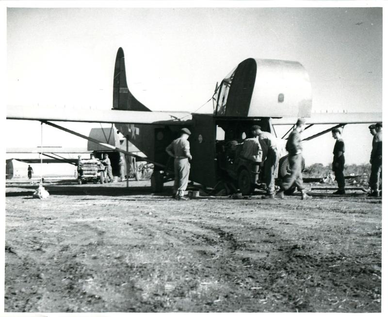 Paratroopers prepare for operations in Greece and load a Waco glider.