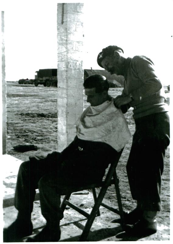 Member of 3 PARA gets a haircut, Shandur camp, Canal Zone, 3/1/52.
