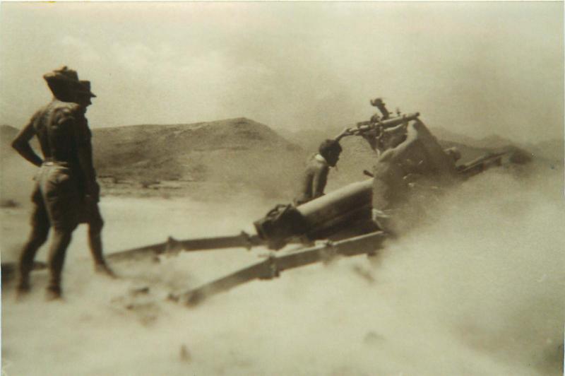 Members of 3rd Royal Horse Artillery firing gun, Thumier Airfield, Aden, 1964