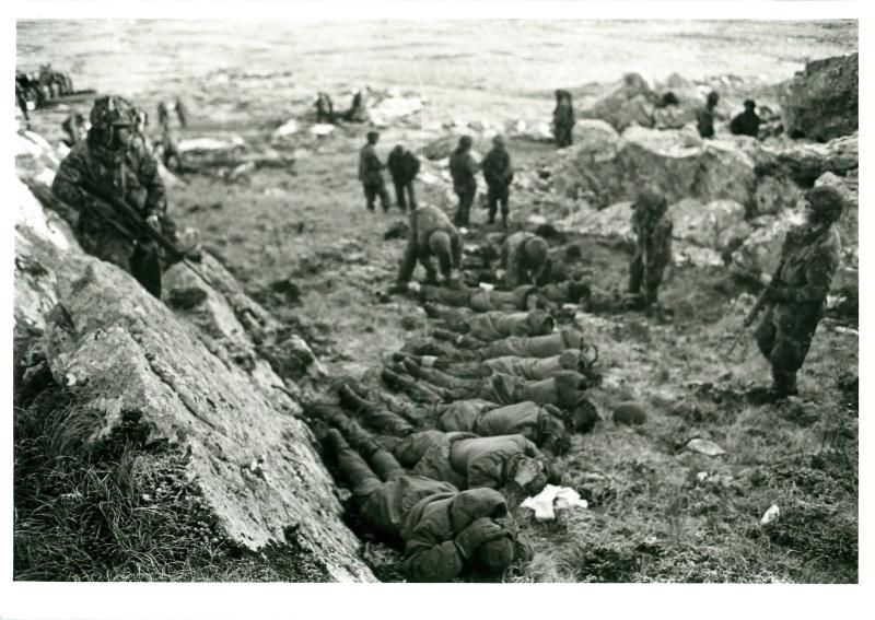 Argentinian prisoners are secured and searched at Mount Longdon.