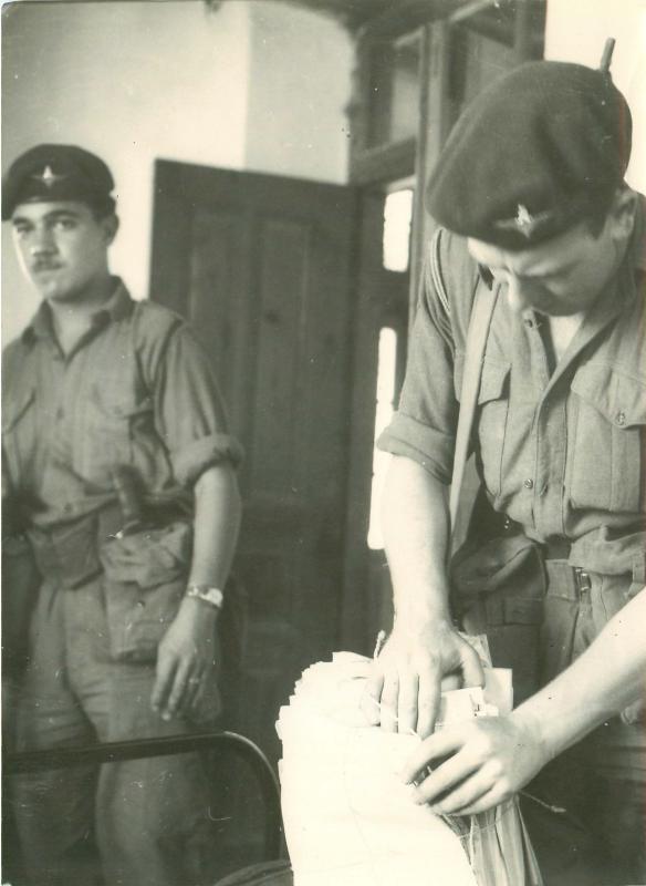 Two paratroopers tackle some paperwork in Cyprus, 1956.