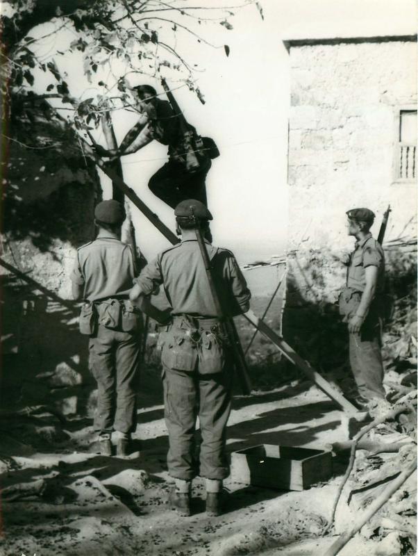 Paratroopers search for arms and ammunition in Cyprue, 1956.