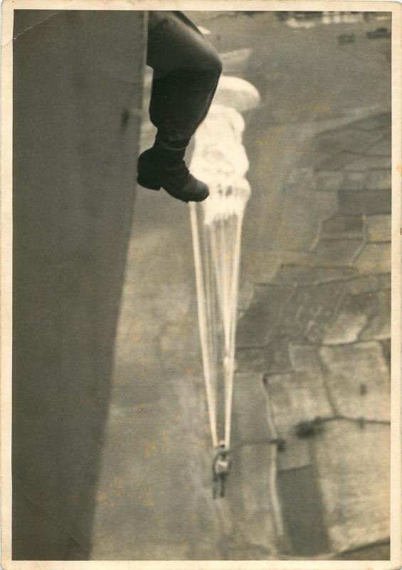 Parachutist exiting a Douglas Dakota during a training jump in India.