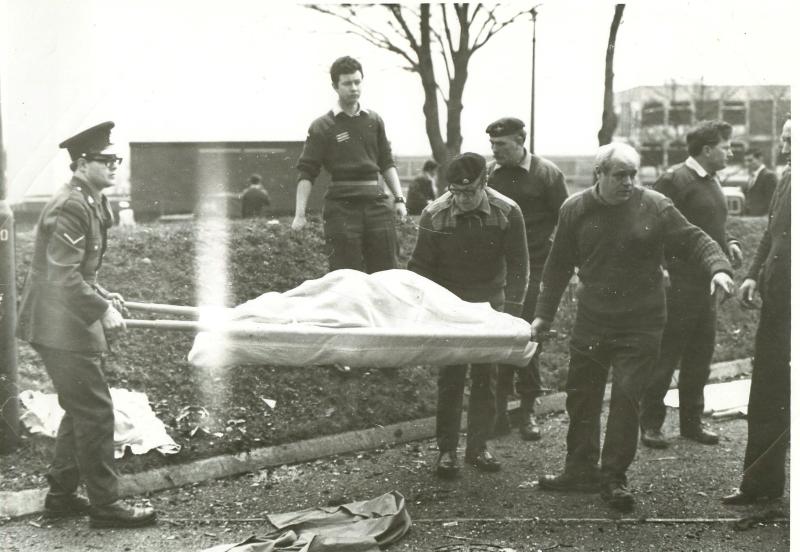 A body is removed from the bombed Officers' Mess at Aldershot barracks.