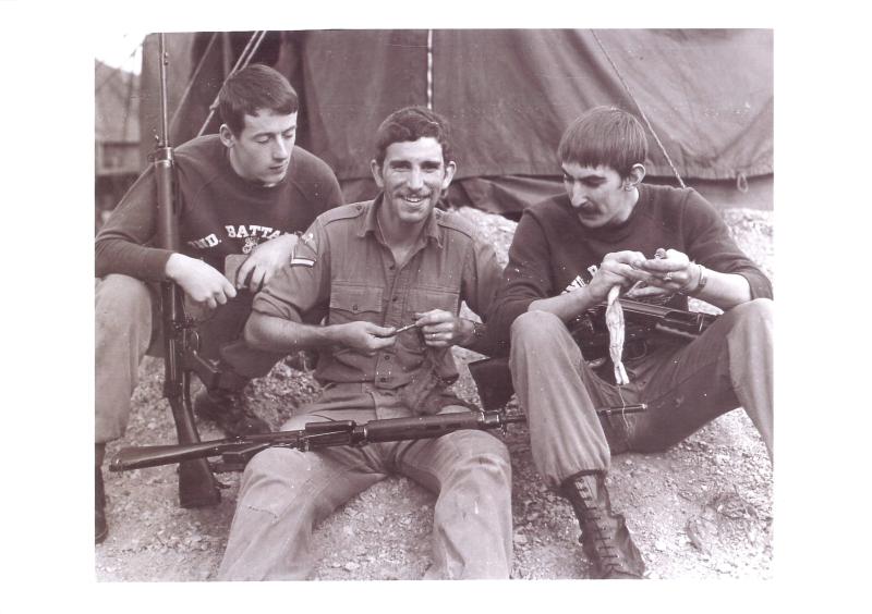 Corporal Stephen Prior and comrades clean their rifles.