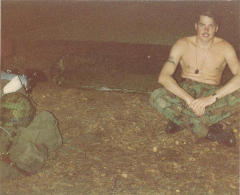 Pte Lee Crichton after making his first 'Basha' on exercise, 1980s