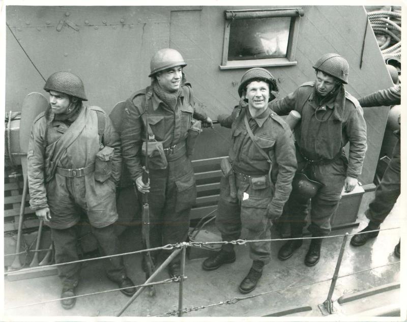 Four of the paratroopers who took part in the Bruneval raid on board landing craft.