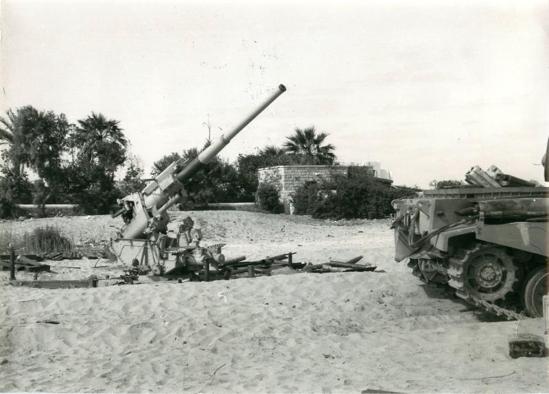 A captured 3.7 inch anti-aircraft gun and other equipment, Suez, November 1956