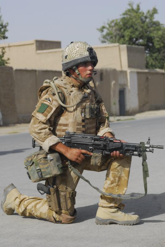 Soldier of A Coy, 3 PARA pauses to survey the area on patrol in Kandahar, Afghanistan, June 2008