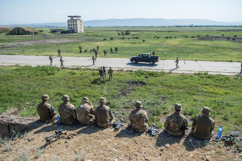 Paratroopers watch a VCP demonstration by Georgian troops