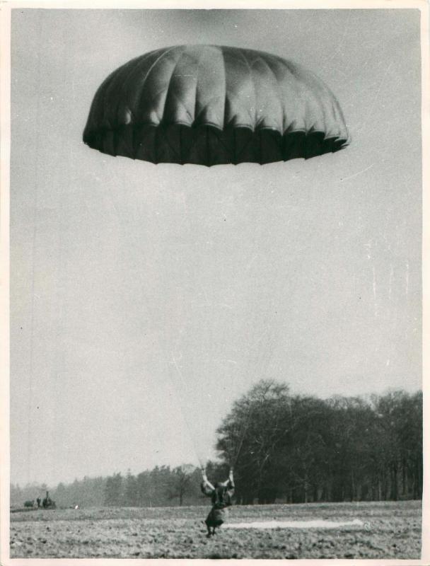 Trainee adopting the parachute position on landing, poss RAF Netheravon.