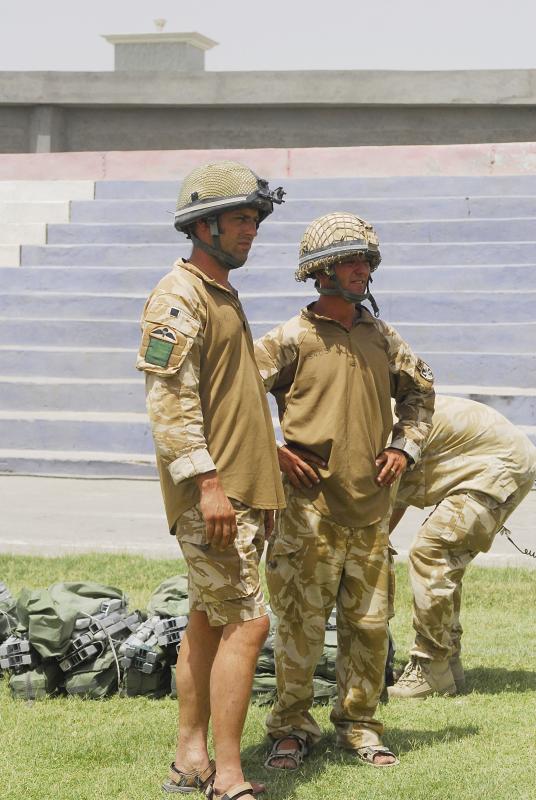 Soldiers of 3 PARA sport helmets and shorts in Kandahar, Afghanistan, June 2008