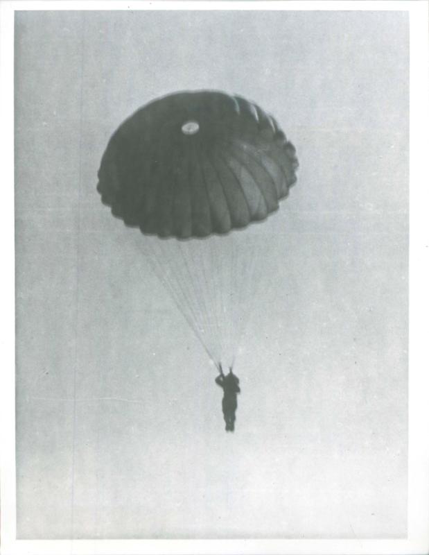 Indian paratrooper adopts the landing position prior to landing.
