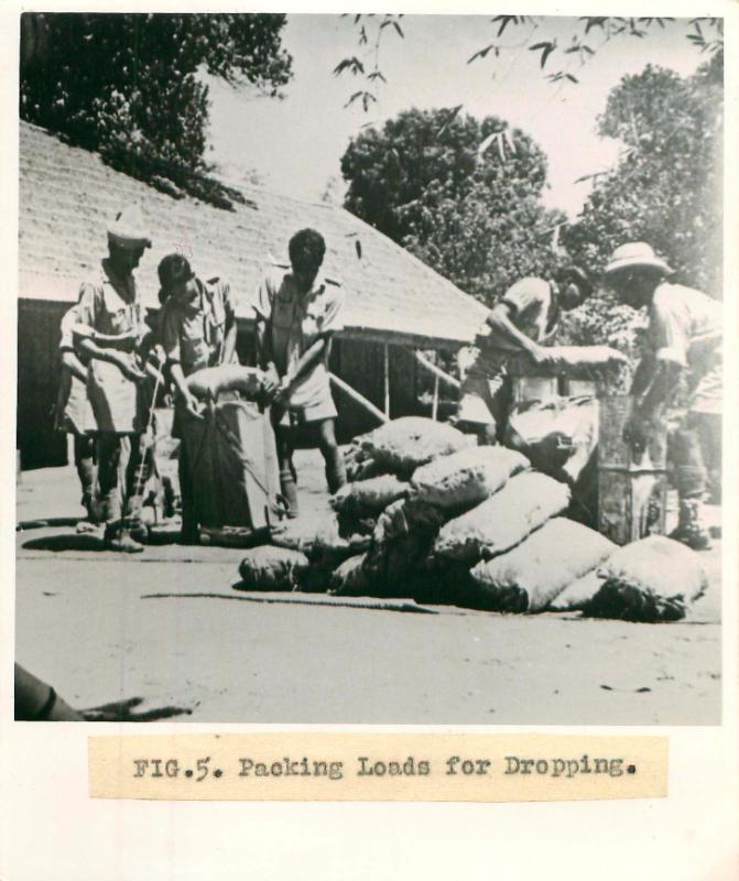 Men from No.1 Indian Air Company pack loads for dropping.