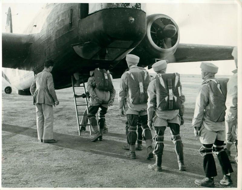 Men emplaning onto a Wellington for their first jumps. November, 1942.