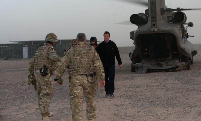 Prime Minister David Cameron is met by members of 16 Air Assault Brigade on a visit to Afghanistan, 2010