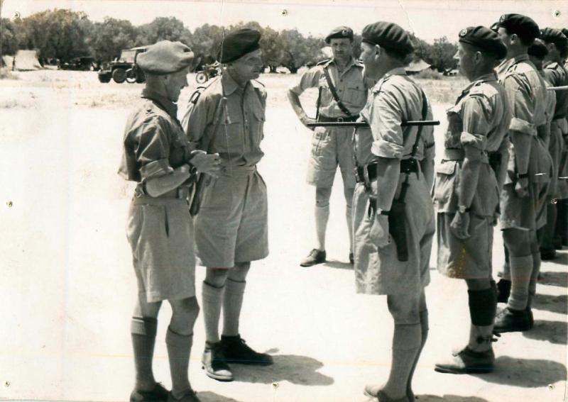 General Montgomery talks to a line of officers.