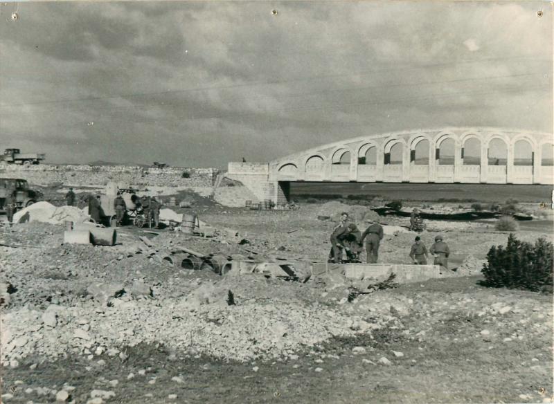 1st Parachute Squadron RE road building in front of a bridge.
