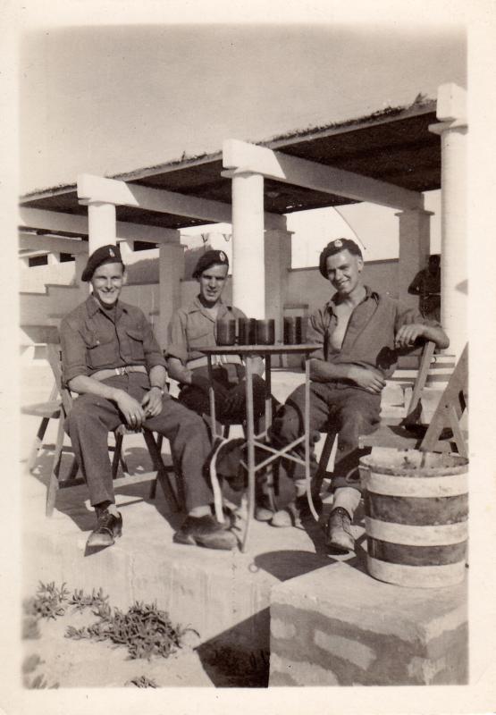 Photo taken at the NAAFI Lido, Gaza Palestine. Private Airey, Private Robins, Driver Cable. 9th Airborne Squadron Royal Engineer