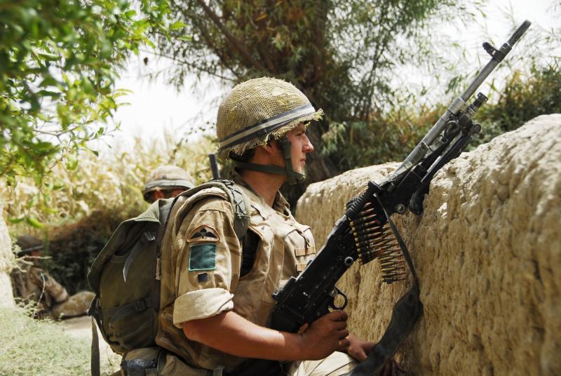 Member of 3 PARA, armed with a GPMG, observing for enemy activity, Afghanistan, 2008