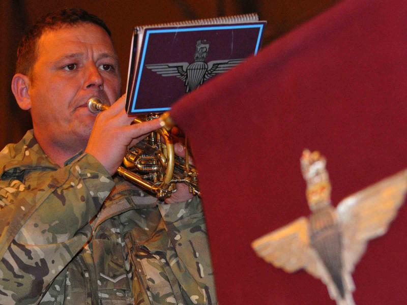 A member of the Parachute Regiment Band, entertaining soldiers at Camp Bastion, Afghanistan, 2010